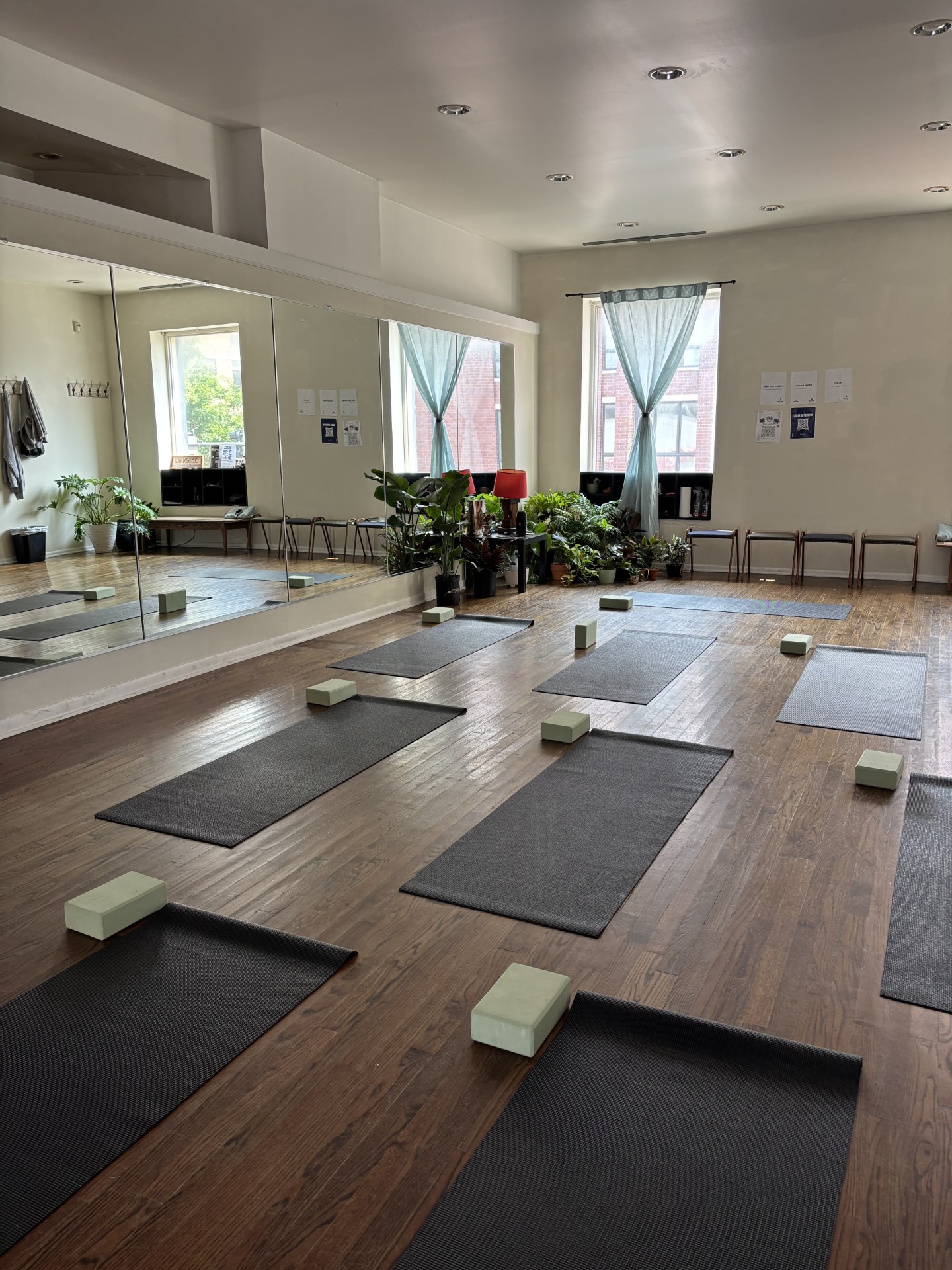Sunlit boutique Pilates studio with reformer machines